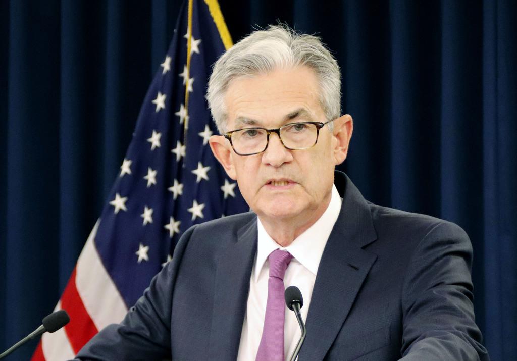 記者会見するFRBのパウエル議長=19日、米ワシントン(共同)