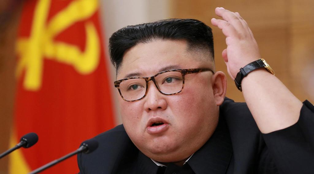 9日、朝鮮労働党中央委員会の会合で発言する金正恩氏(朝鮮中央通信=ロイター)