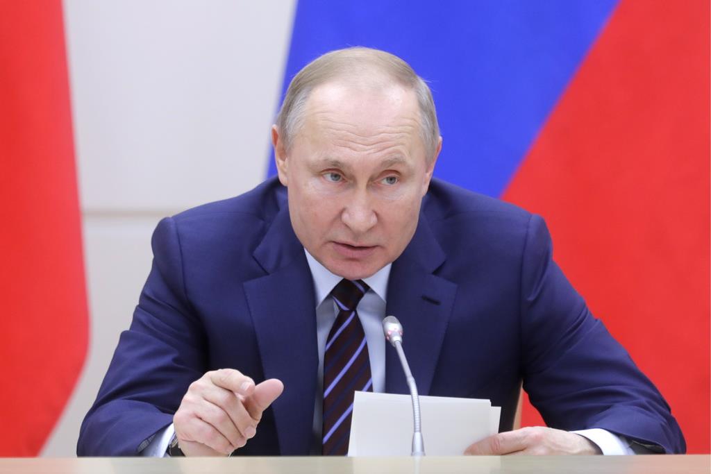 対外情報活動を重視するロシアのプーチン大統領(タス=共同)